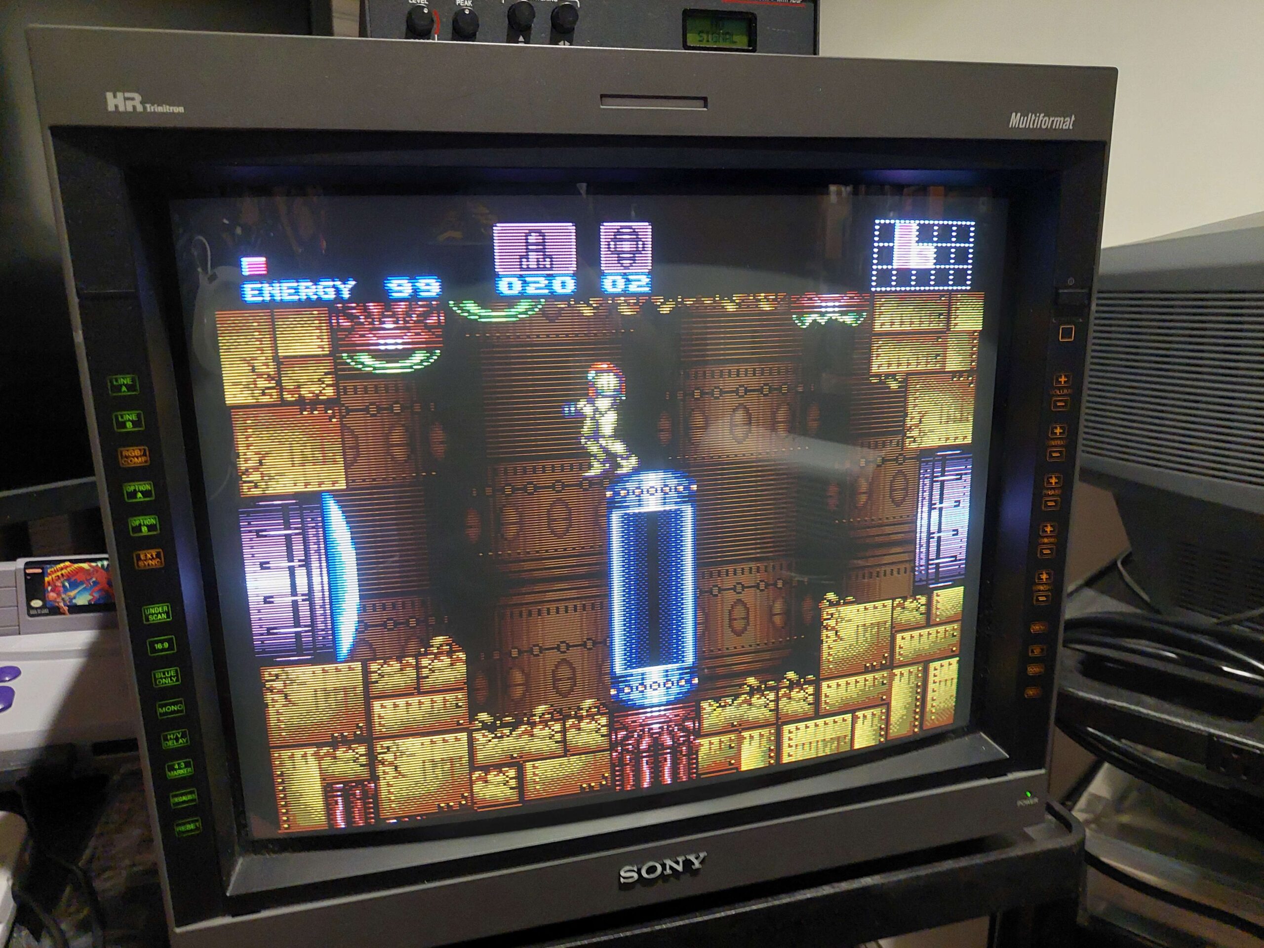 SUper Metroid is being played on a very fancy CRT television, using the modded SNES Jr